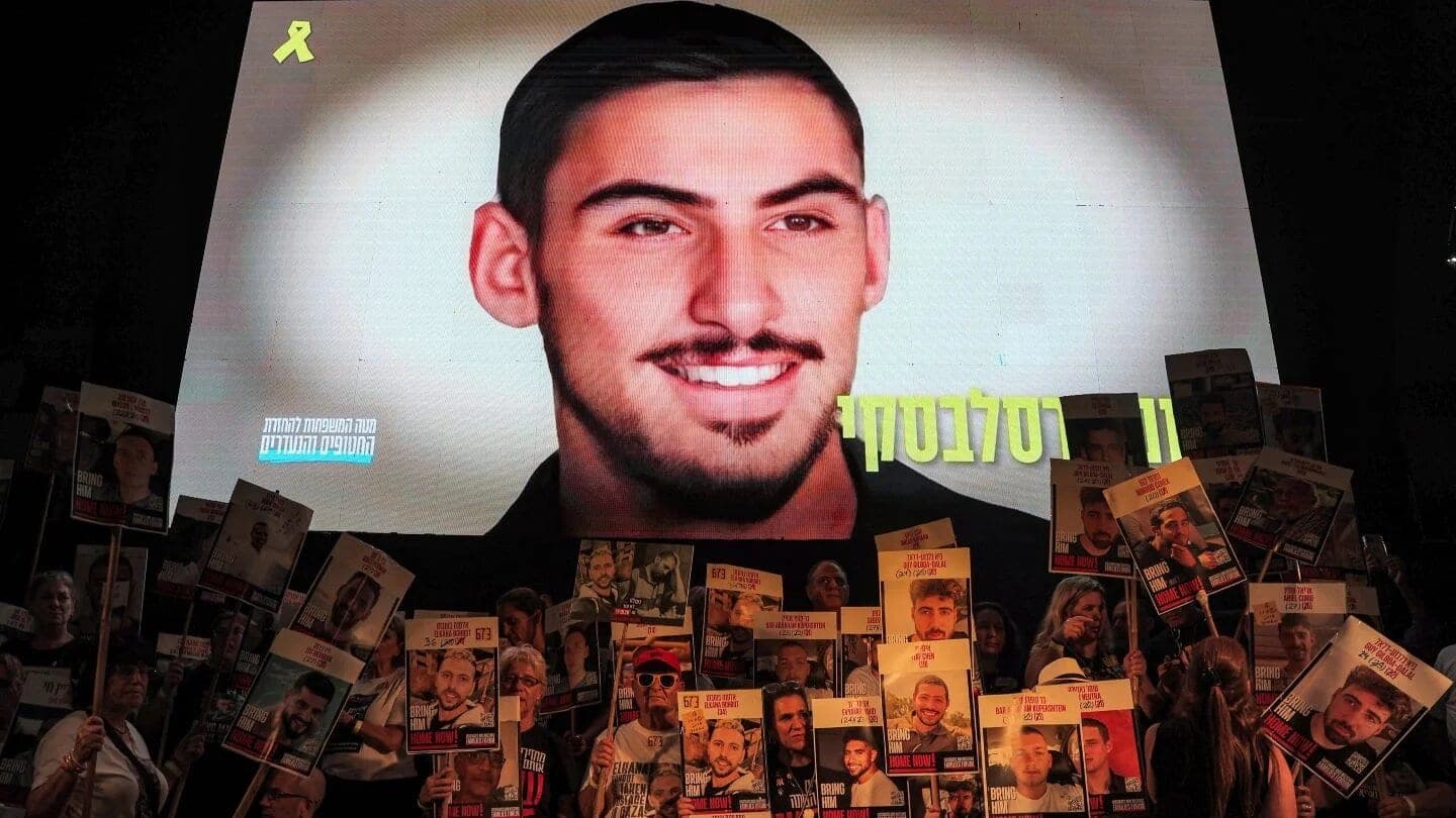 An image of Israeli hostage Rom Braslavski is displayed during a demonstration at Hostages’ Square in Tel Aviv, 9 August 2025 (Jack Guez/AFP)