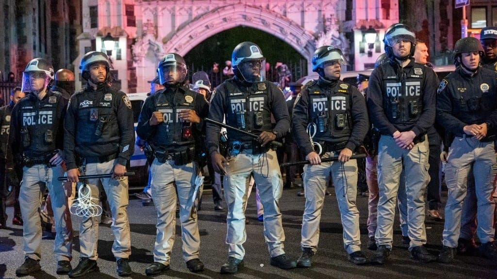 Police look on during pro-Palestinian demonstrations at The CUNY as the NYPD cracks down on protest camps at both Columbia University and CCNY on April 30 (Spencer Platt/AFP)